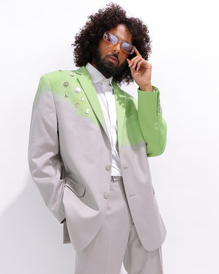 curly hair man wear dip dyed designer lime green and tan blazer with enamel pins